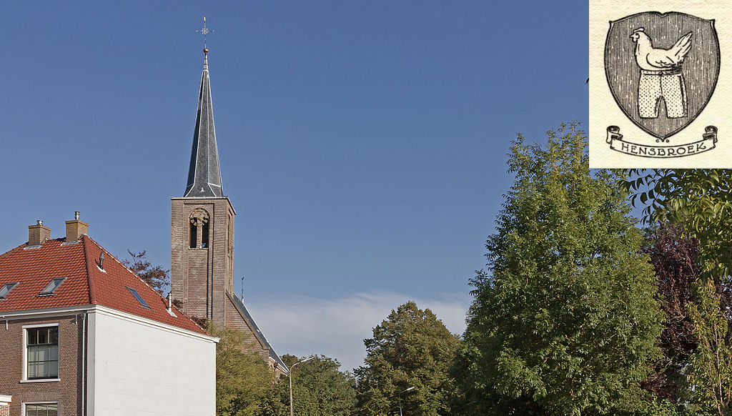 A photograph of a clocktower, building and treeline with the coat of arms of Hensbroek in the top right corner. The coat of arms is a chicken wearing trousers.