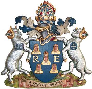 A coat of arms depicting two rams either side of a blue shield.