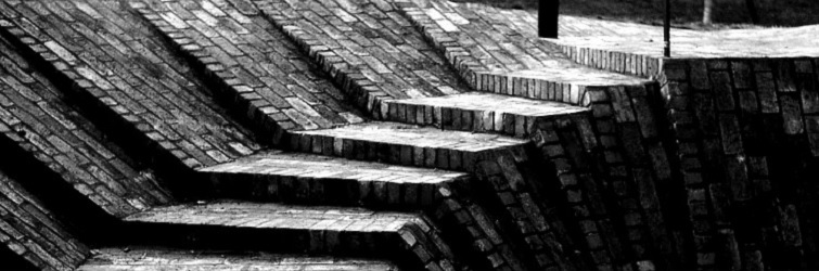 Close up black and white photograph of brick steps at the Brunel Estate