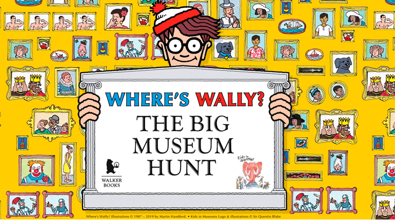 Wally holding up a sign saying Where's Wally? The Big Museum Hunt