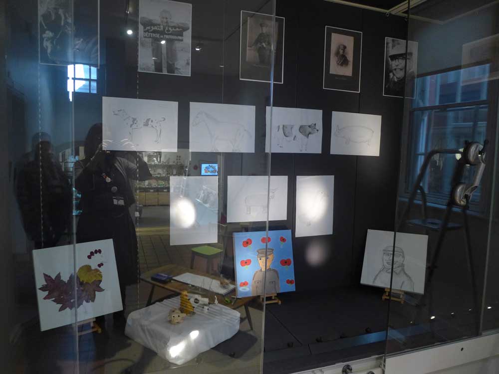 Student artwork displayed in a glass case