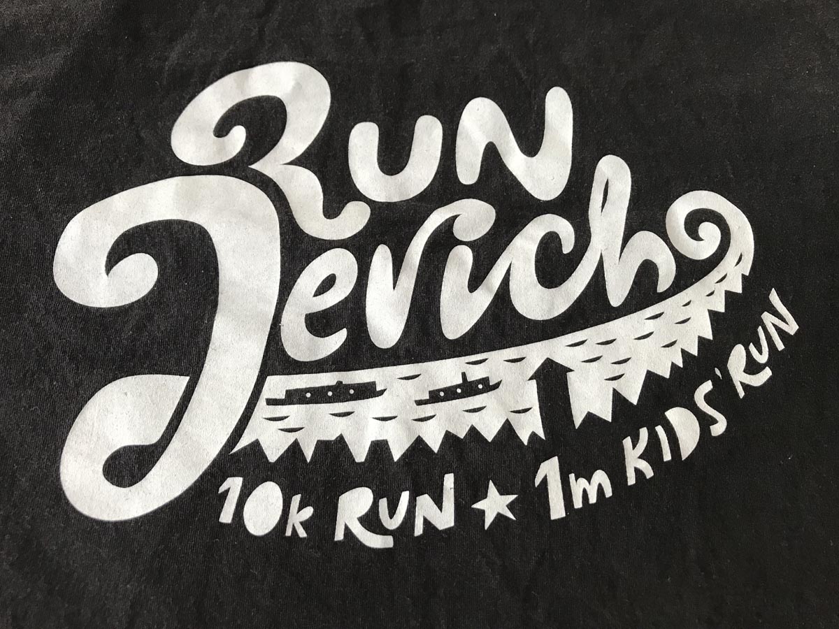 Detail showing white writing reading 'Run Jericho: 10k run, 1m kids run'