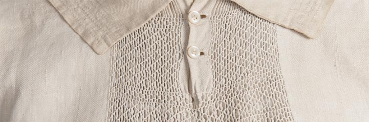 Smocked collar area in white linen