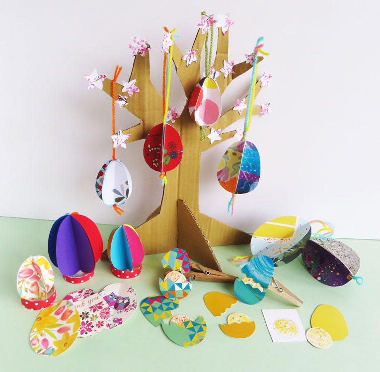 Colourful card 3D eggs hanging on a cardboard tree