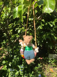 Little Mouse on a swing in Charlotte's garden