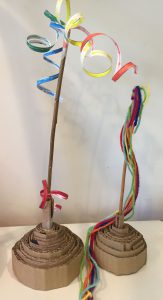 Two mini Maypoles crafted by Fong