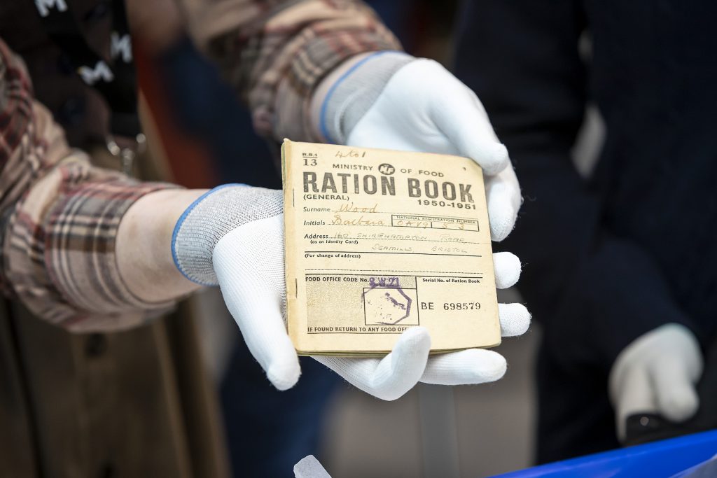 Close up of object handling a ration book