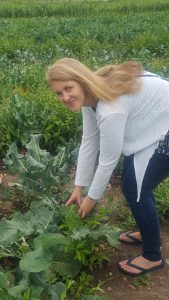 Susanna picking broccoli at Pick Your Own farm