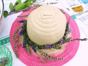 Lavender tied around the brim of a straw hat