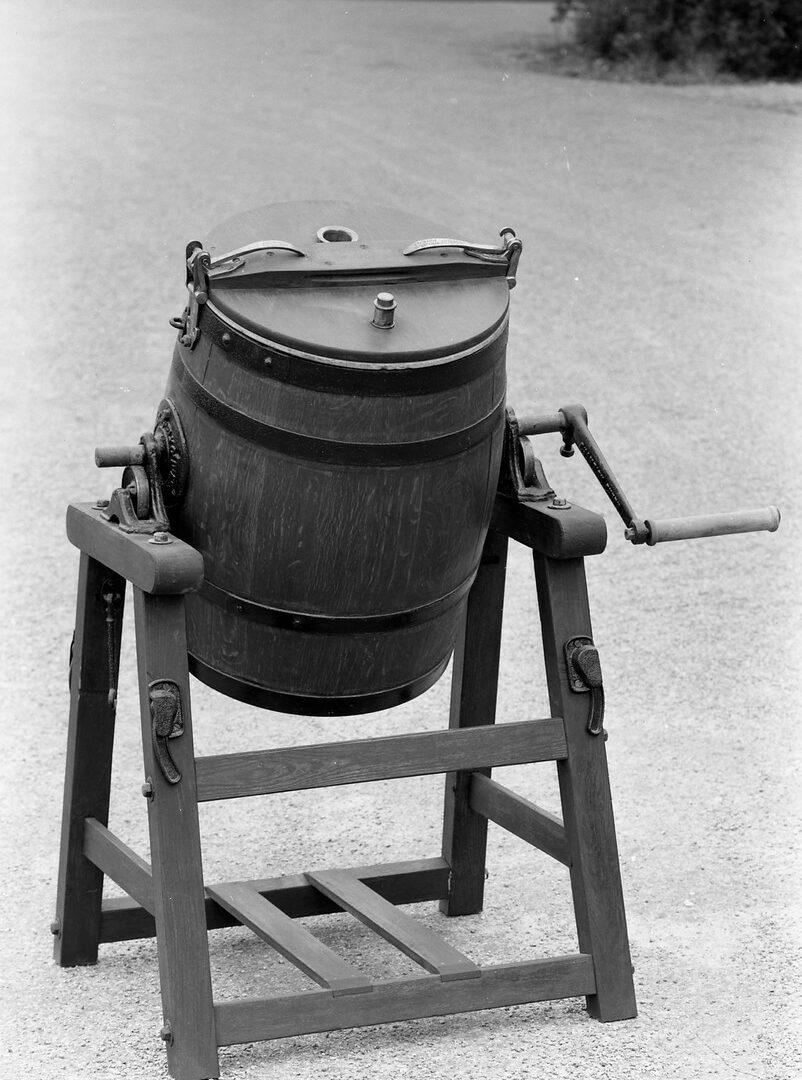 This butter churn was used for making butter, and is of a type generally used in larger dairies. It is inscribed: 'Champion churn used by the champion butter makers of England and Scotland'. (MERL 56/359)