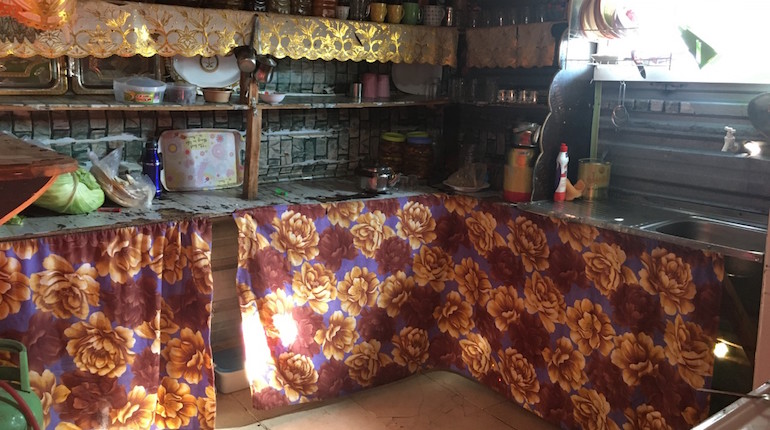 A makeshift kitchen in a refugee caravan in the Zaatari refugee camp, 2019. Photo by Yasmine Shamma