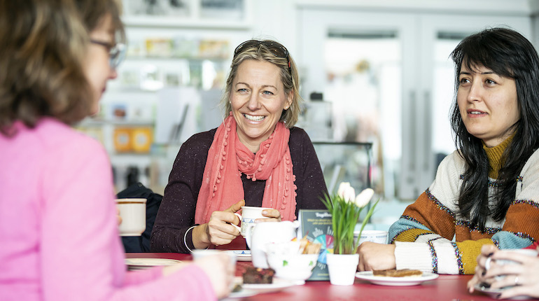 Three women having Hot Drinks in the MERL Cafe