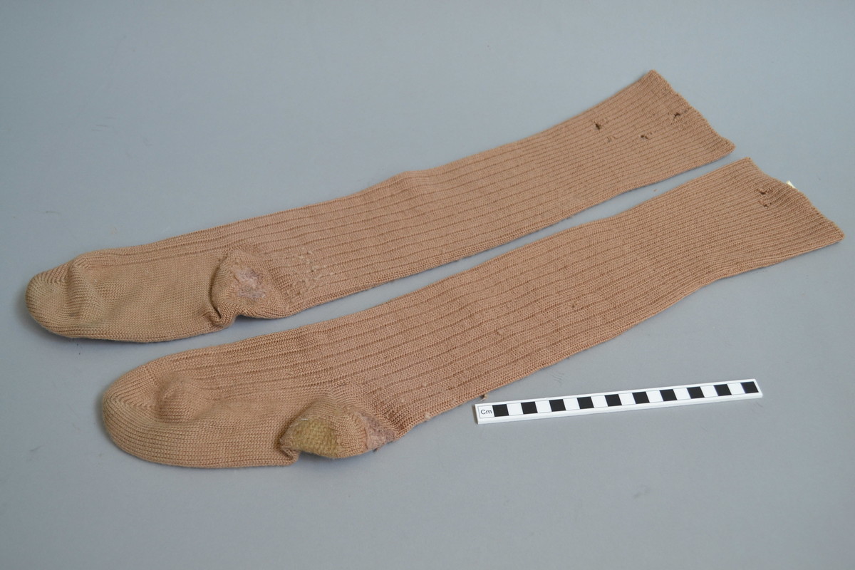 This is a pair of Women's Land Army (W.L.A.) standard issue socks. They belonged to Gwendoline Hayes, who enrolled in the W.L.A. on 13th November 1941 and left in March 1946. 