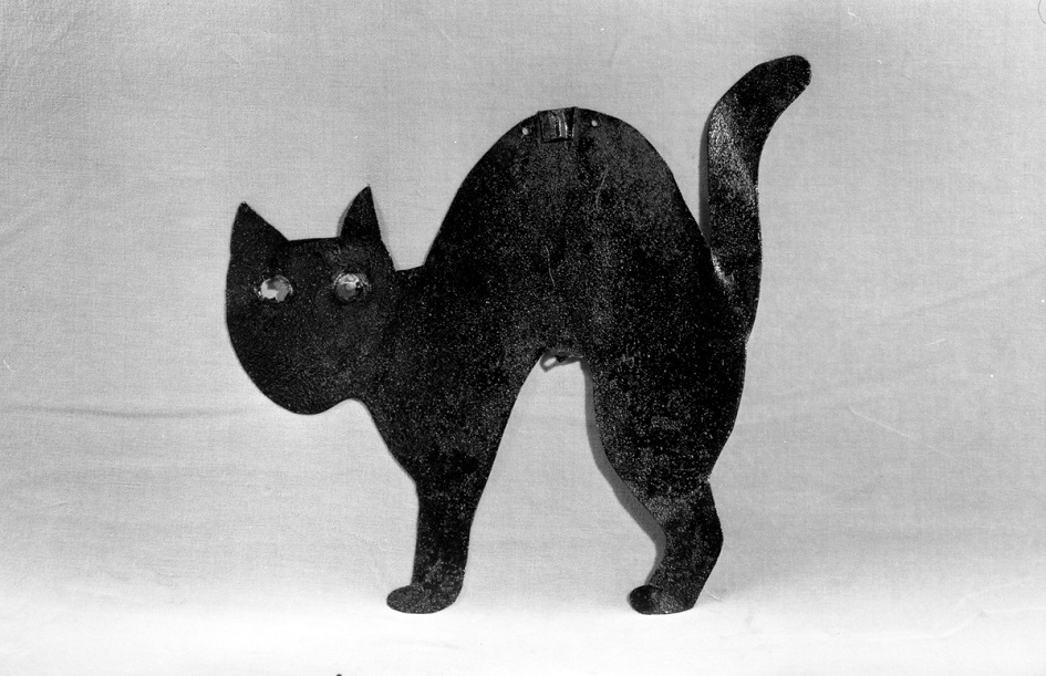 This tin bird scarer is made in the shape of a cat. Bird scarers were used to keep birds away from crops. This bird scarer was used in Surrey. (MERL 56/371)