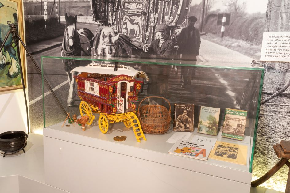 Part of the “Open Road” display in the Museum’s permanent galleries. Images of GRT communities and a model caravan.