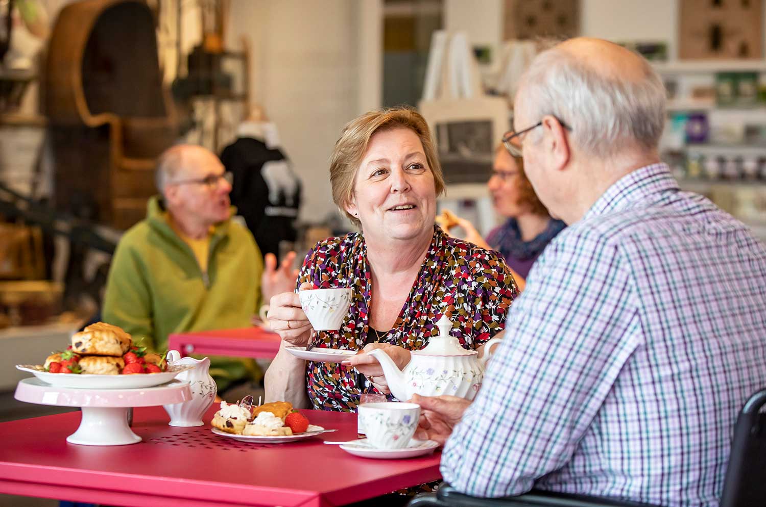 A couple enjoy a cream tea in the MERL cafe