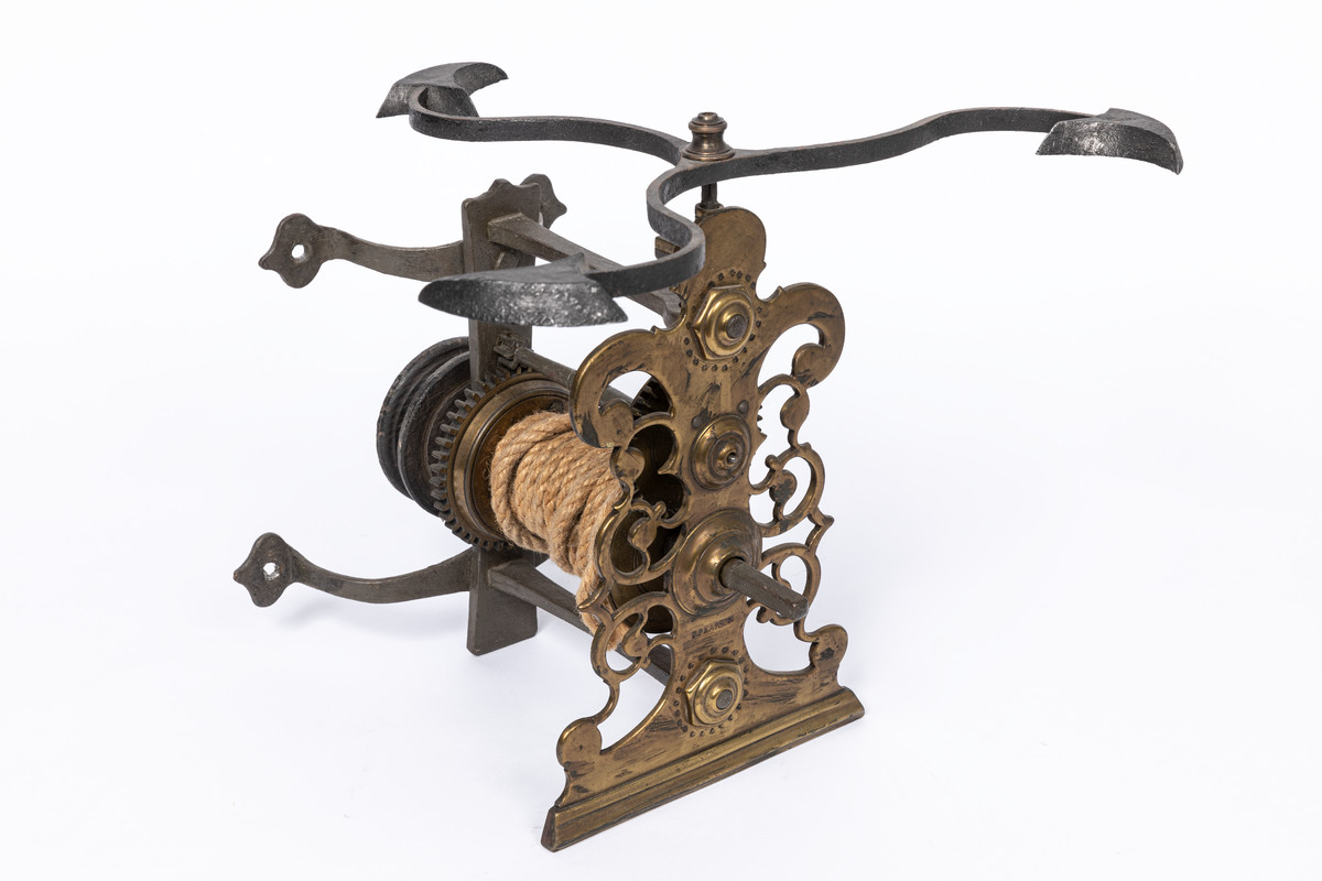 A jack is a device used for turning a spit. This is a seventeenth-century jack made of brass and iron, stamped with the name 'P. Pearson', which is the name of the maker and not the jack. We think so, at least. (59/257)