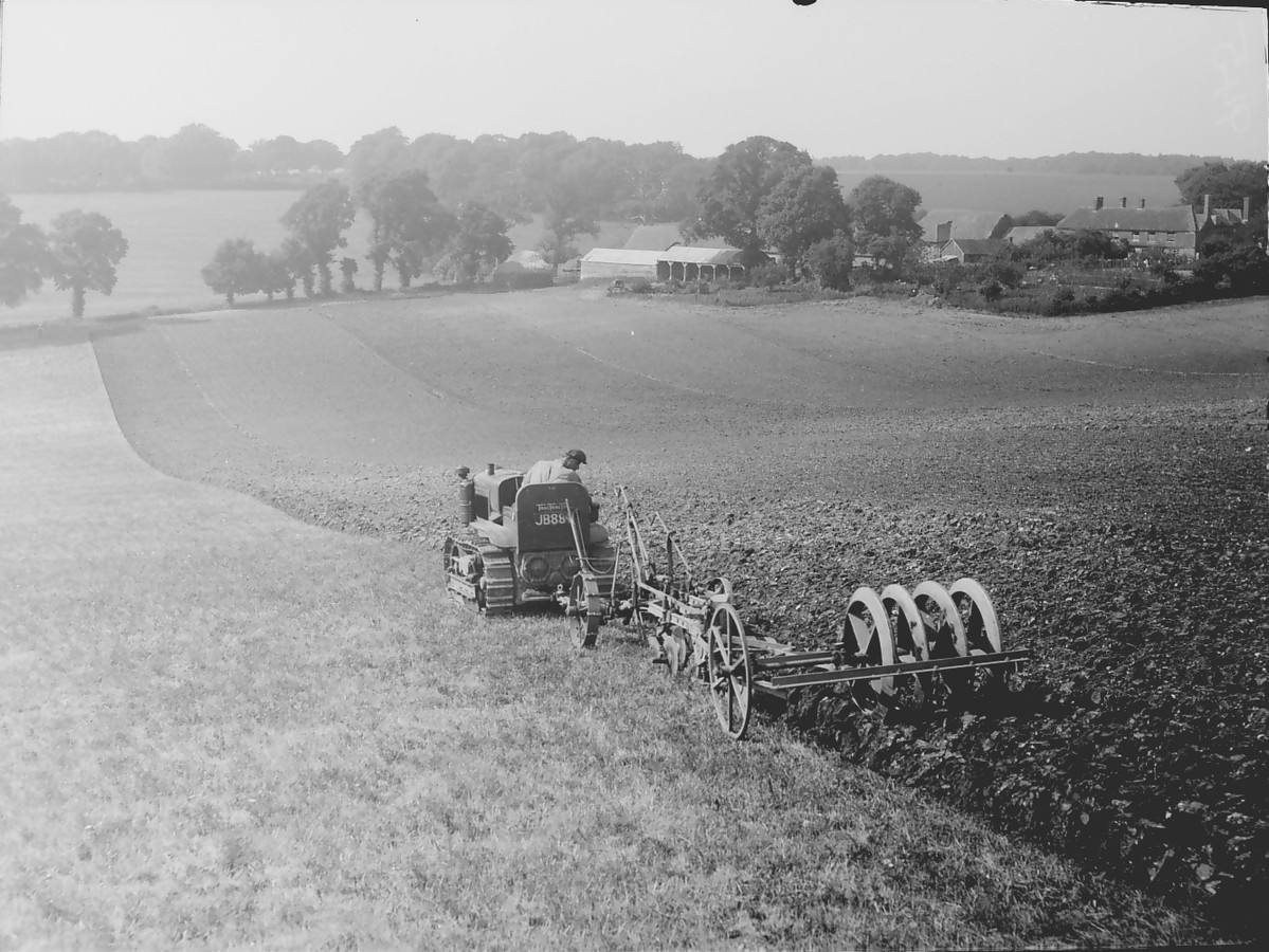 A farmer ploughing a field.