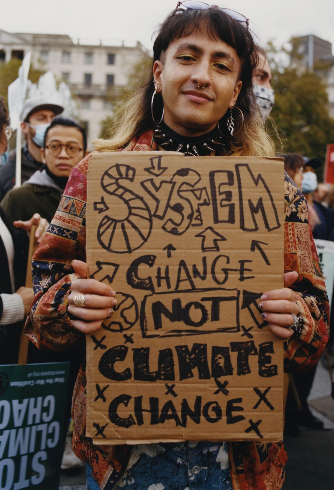 System change, not climate change. Dawood campaigned at the London Global Day of Action in November 2021.