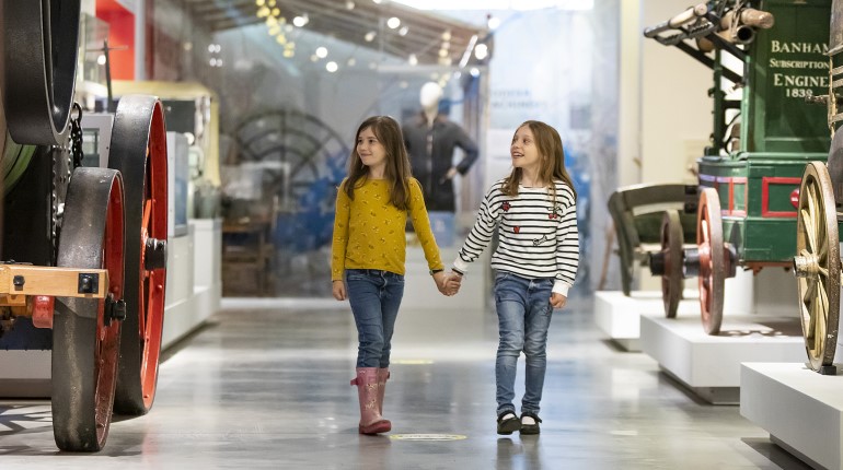 Two girls walking in The MERL galleries