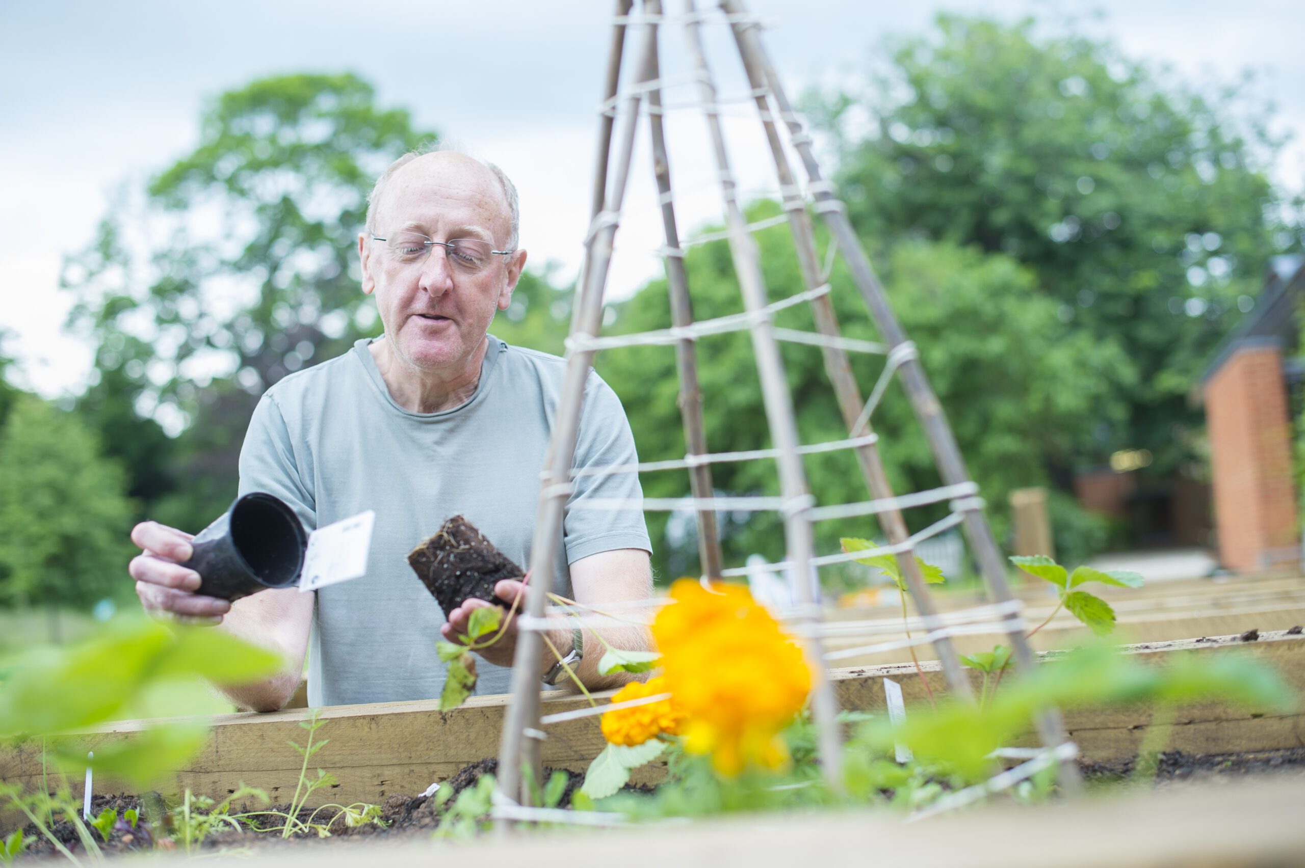 A volunteer works in The MERL garden.