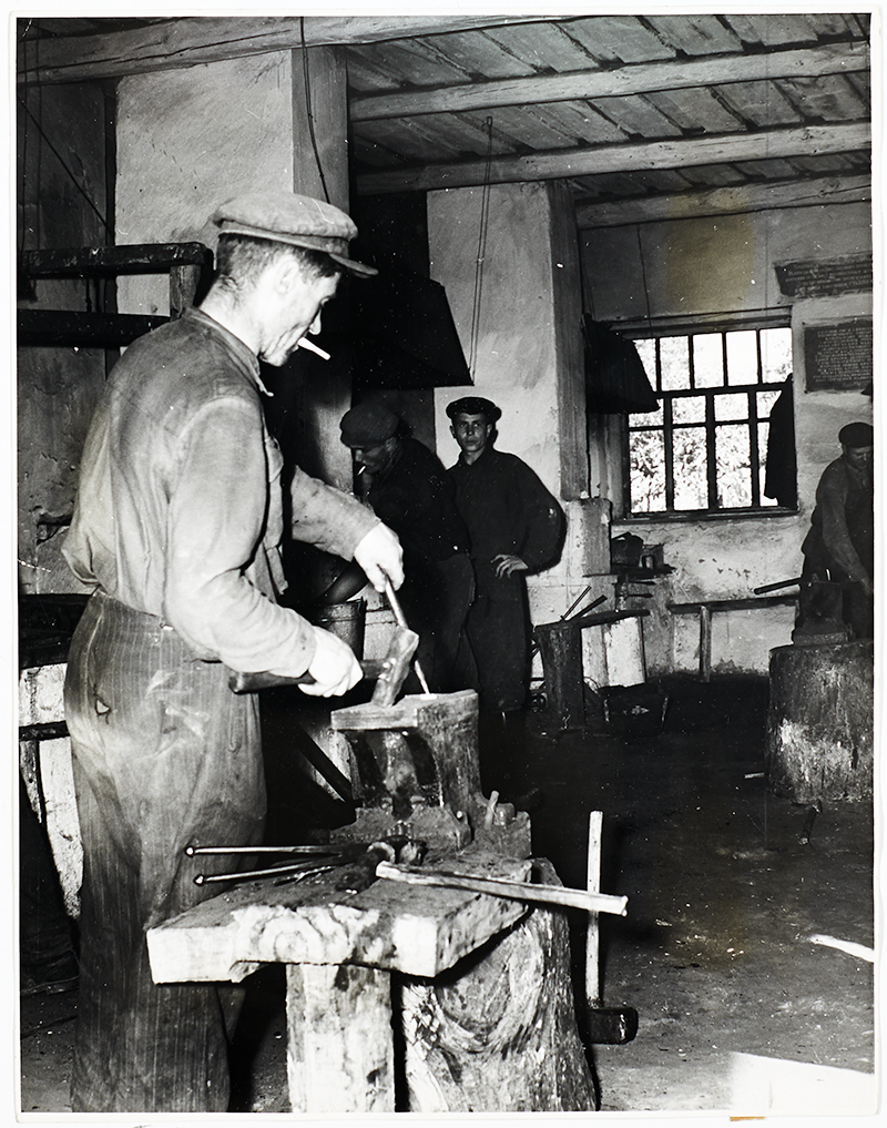 Blacksmiths in a workshop.