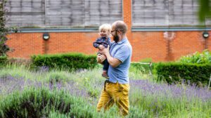 family attends Friday Fledglings in the MERL garden