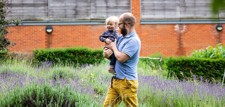 family attends Friday Fledglings in the MERL garden