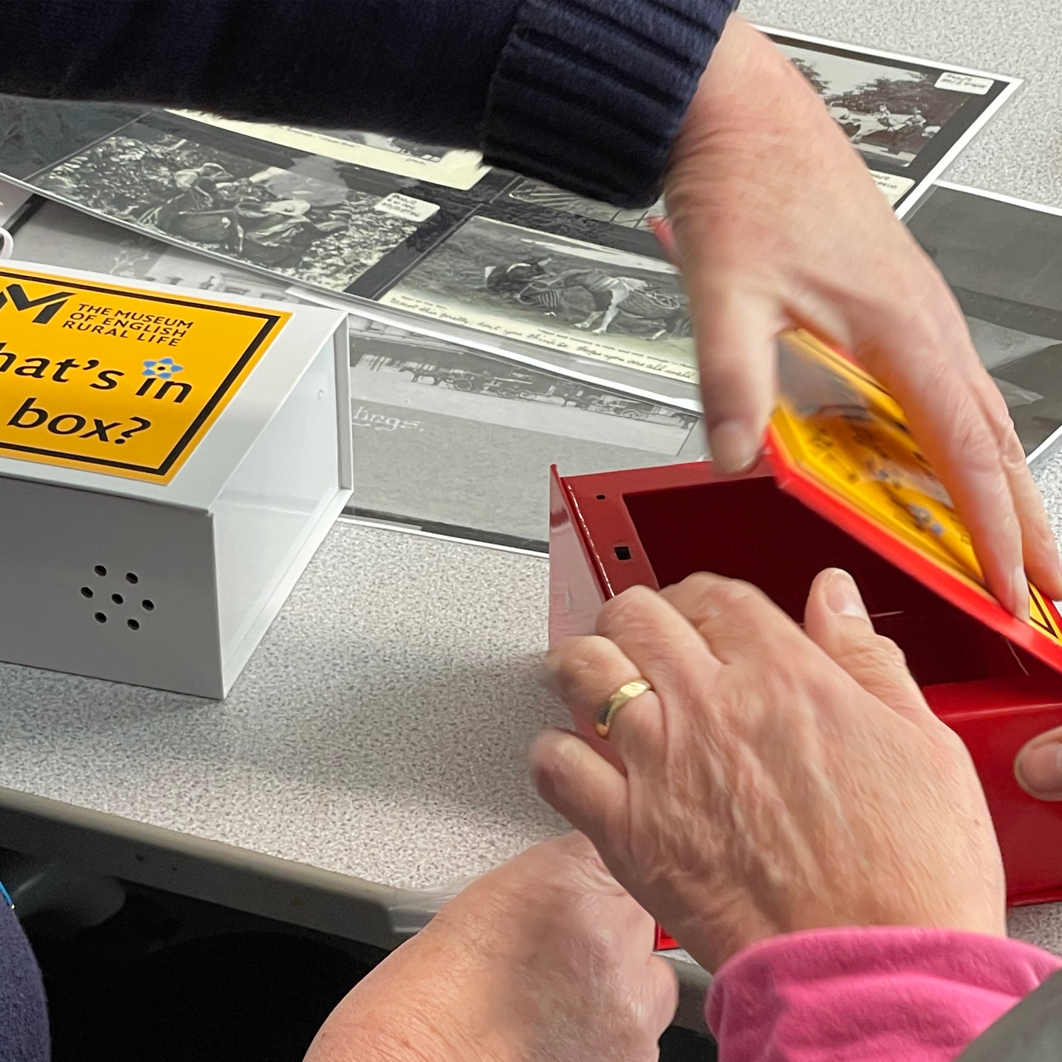 Members of the public opening a compartment of an AMuSED Box.