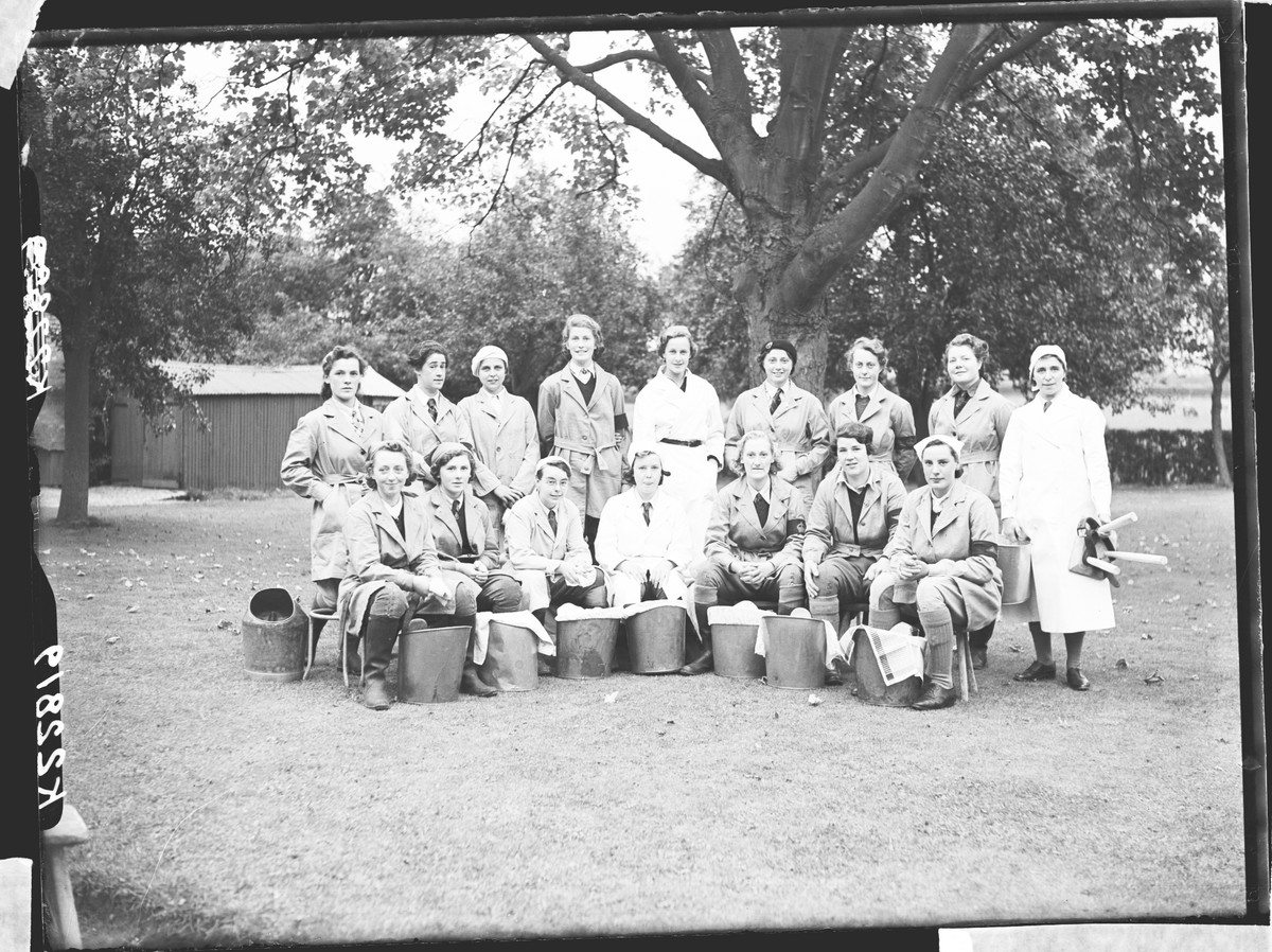 A group of Land Girls posing for a photo.