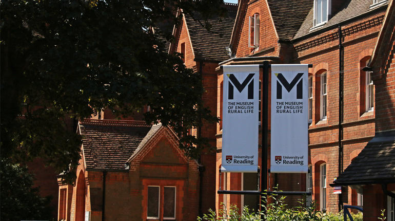 Banners with the MERL logo in front of a Victorian brick building, East Thorpe