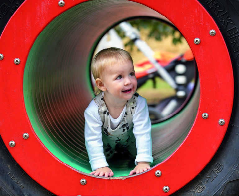 A child plays in The MERL garden.