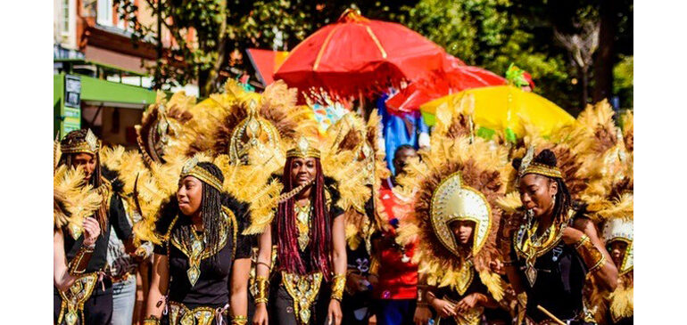 Dancers in brightly coloured carnival costume