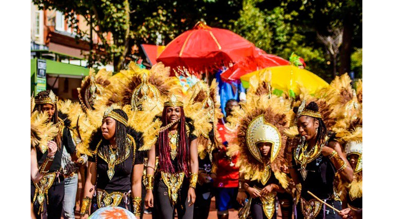 Dancers in brightly coloured carnival costume