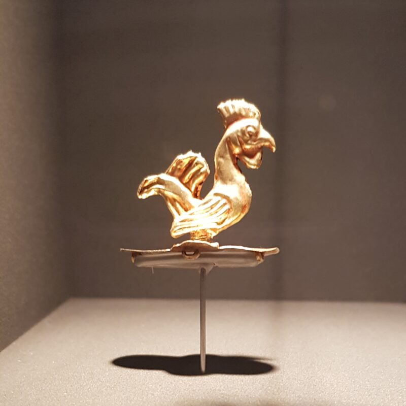 A miniature golden figurine of a rooster at the Kyrgyz State History Museum in Bishkek.
