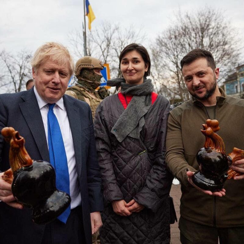 Former Prime Minister Boris Johnson and President of Ukraine Volodymyr Zelenskyy hold ceramic cockerels.