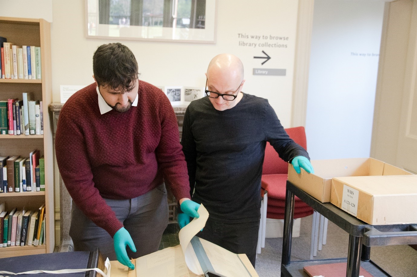 In this photo the Special Collections volunteers are looking through the WHSmith archives for evidence of the Waterloo Loop railway station bookstall.