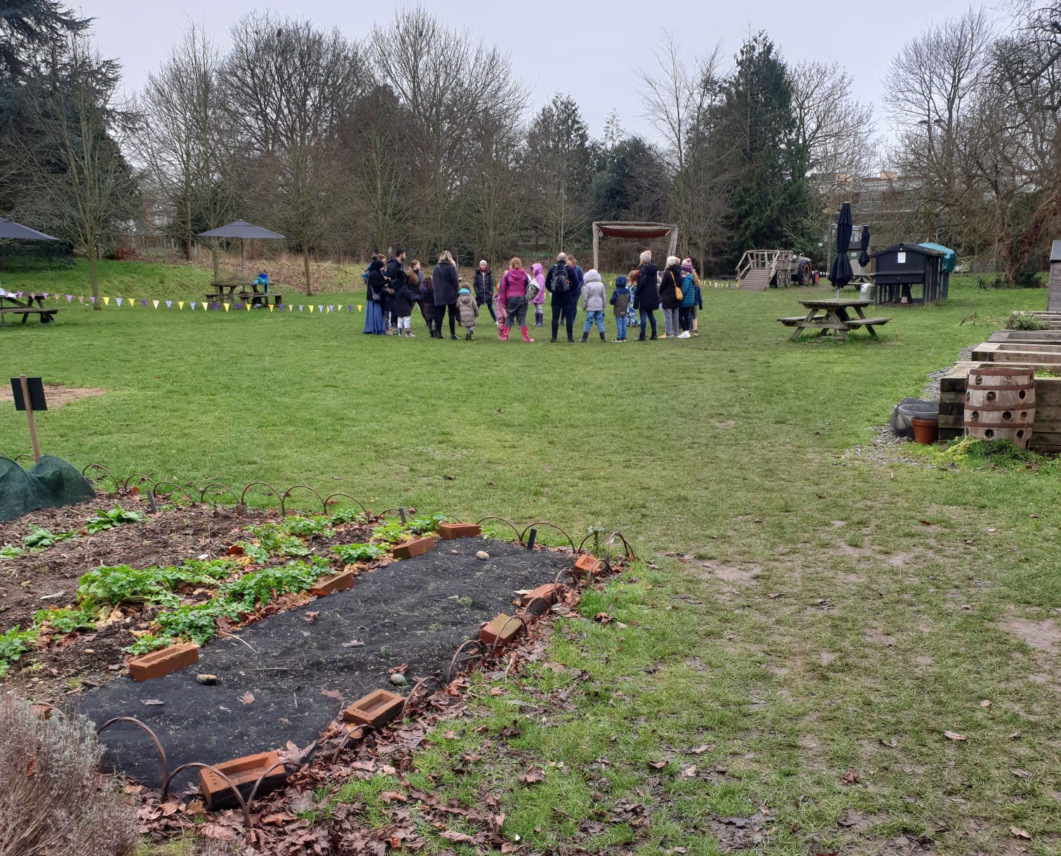 Families gathered in the MERL garden for Green Explorers session
