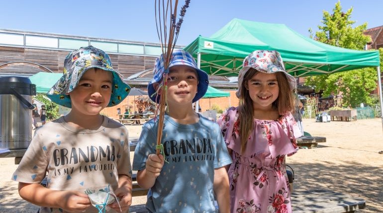 Children in the MERL garden on a sunny day