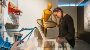 A young person looking at an object in the MERL galleries