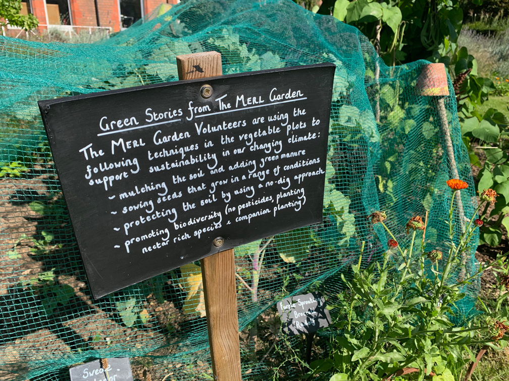 A sign in the MERL garden describing the volunteers' sustainable gardening methods
