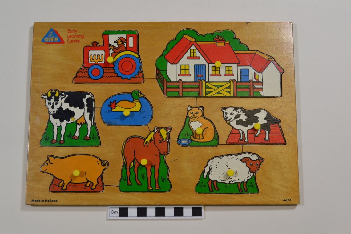 Early Learning Centre farm puzzle, featuring a tractor, cow, horse, pig, sheep and cat.
