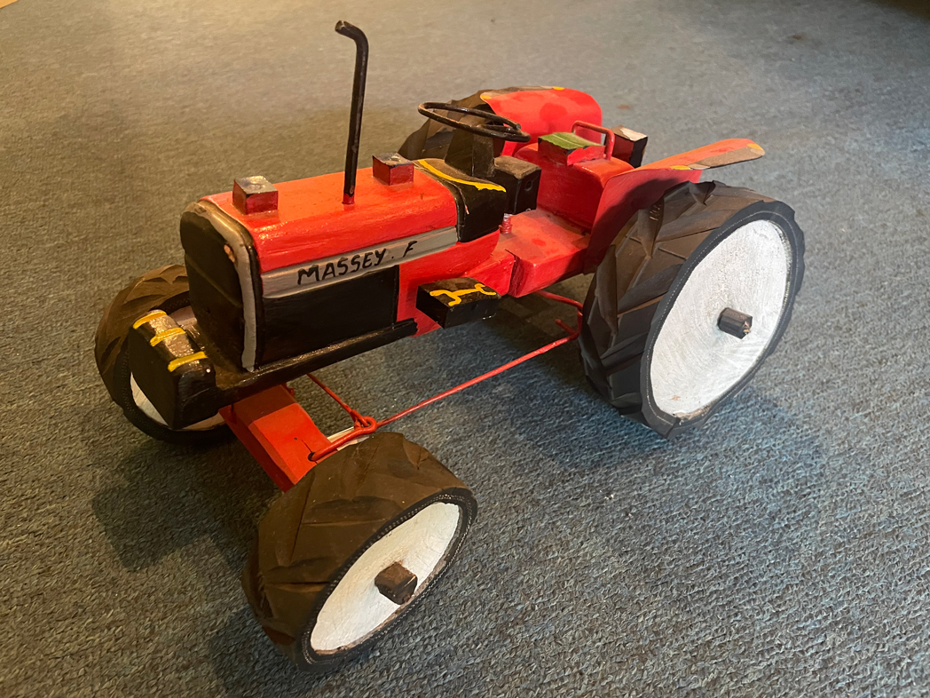 The wooden toy Massey-Ferguson tractor the MERL curator bought for himself in Kenya