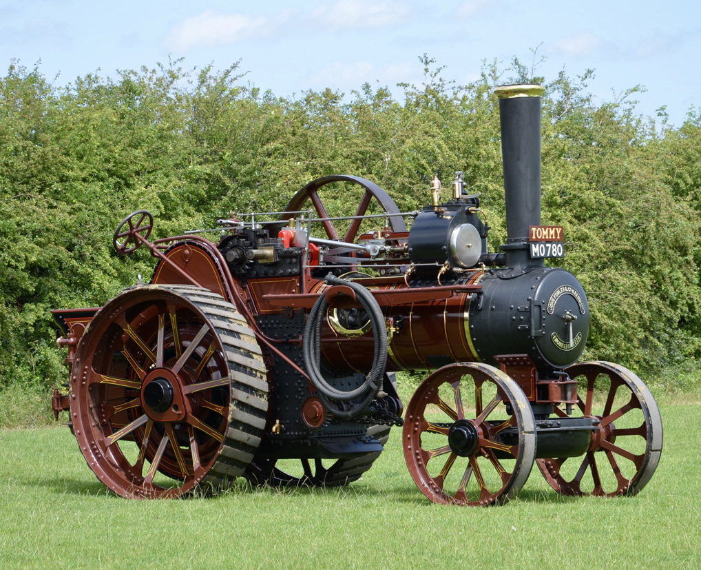 Photograph of a restored steam engine in a field