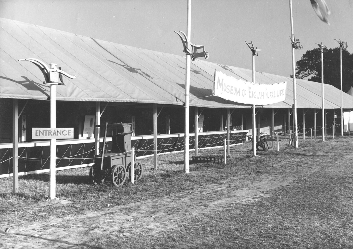 The Museum’s stand at the Royal Agricultural Show in 1952, which featured scale models of ploughs from the Festival of Britain displayed prominently on poles (MERL D/MERL).