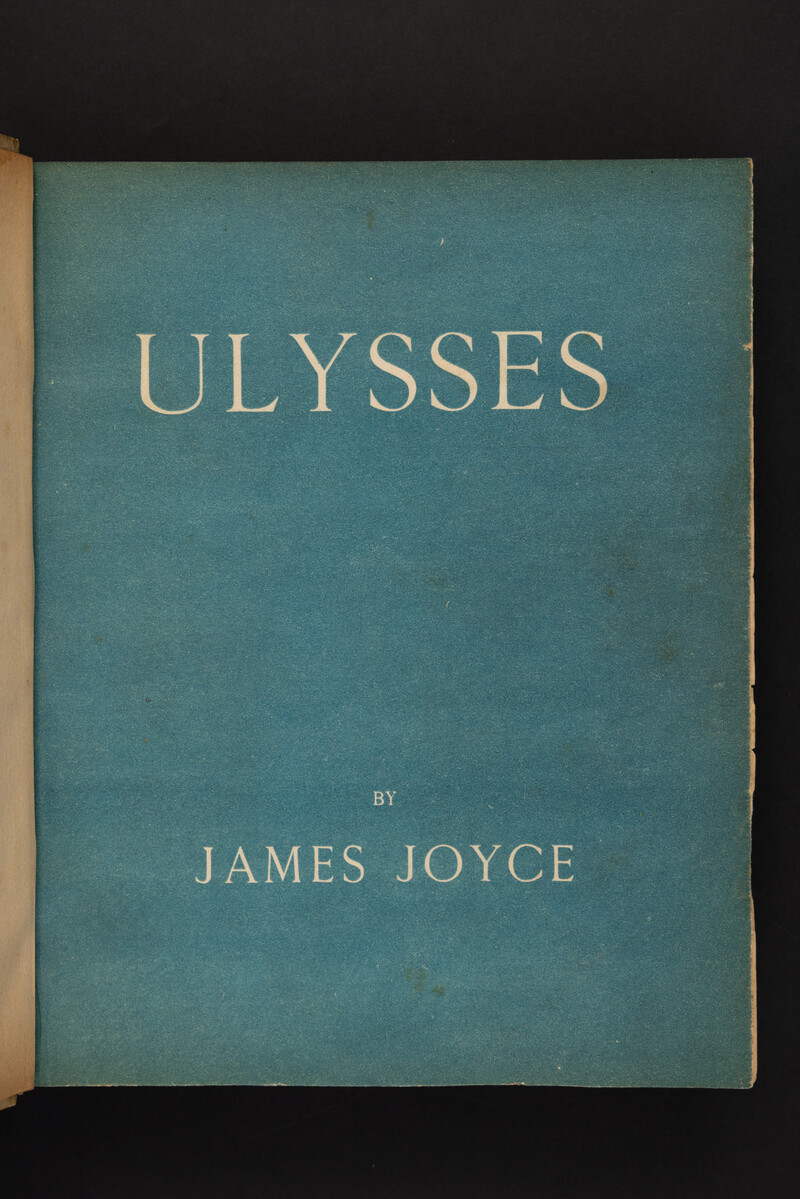 Title Ulysses by James Joyce printed in capital letters on a faded blue background