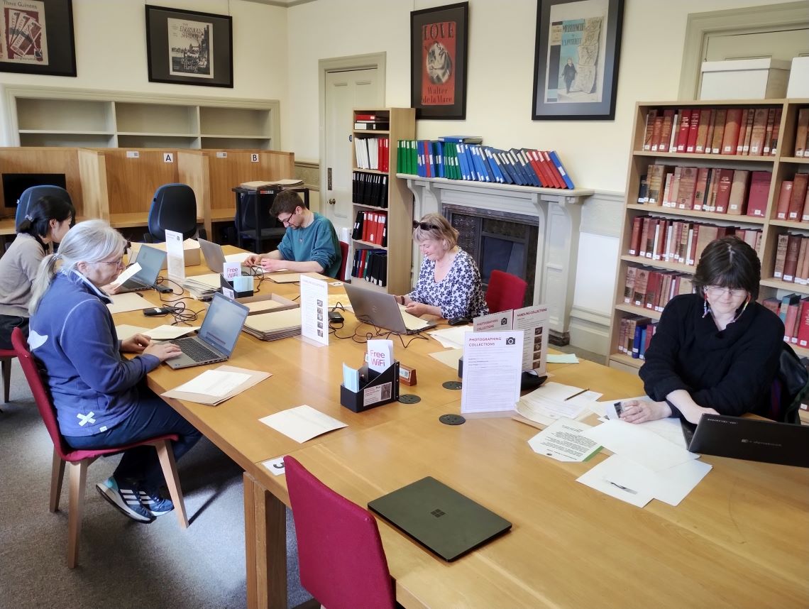 Photograph of volunteers working in the MERL reading room