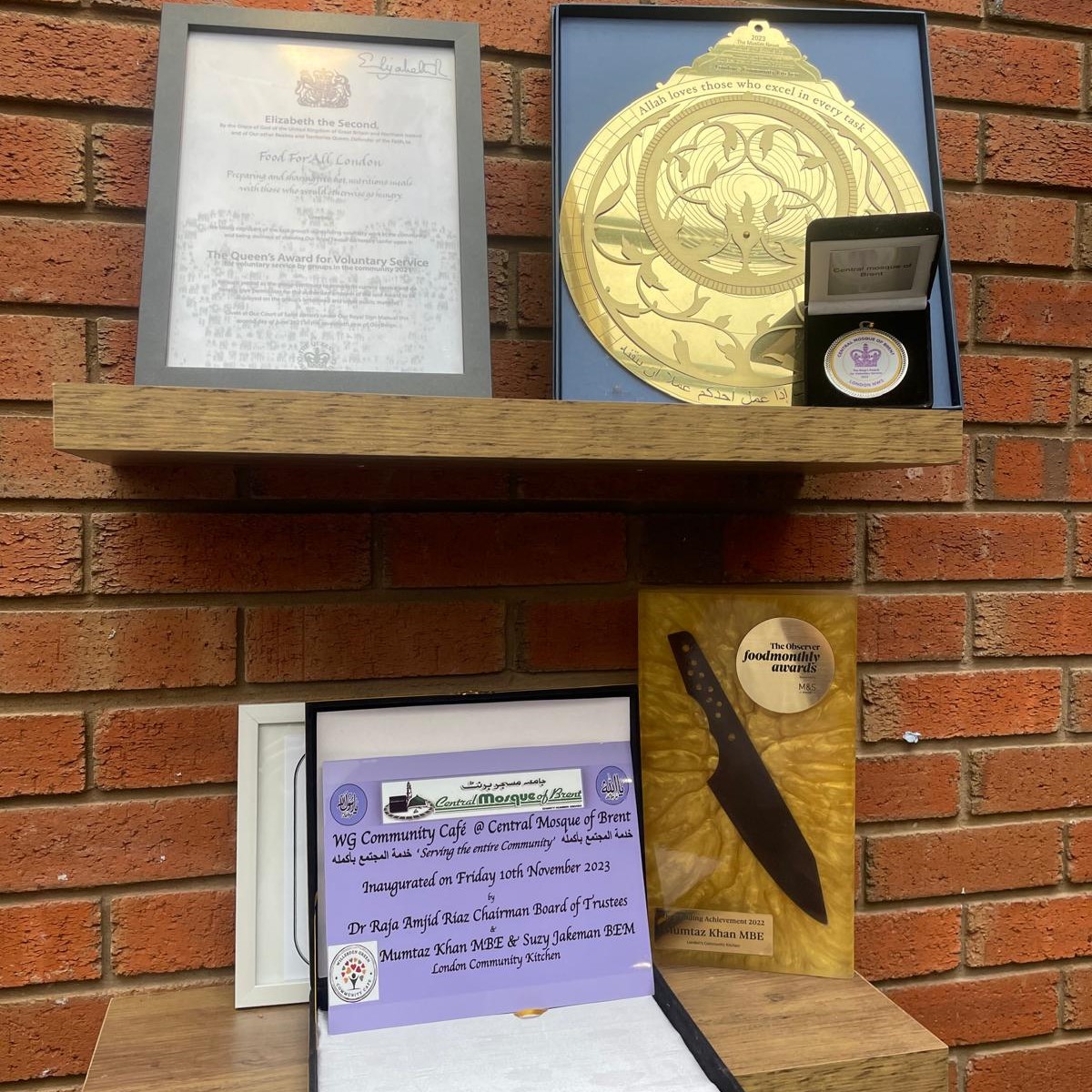 Four awards on a shelf