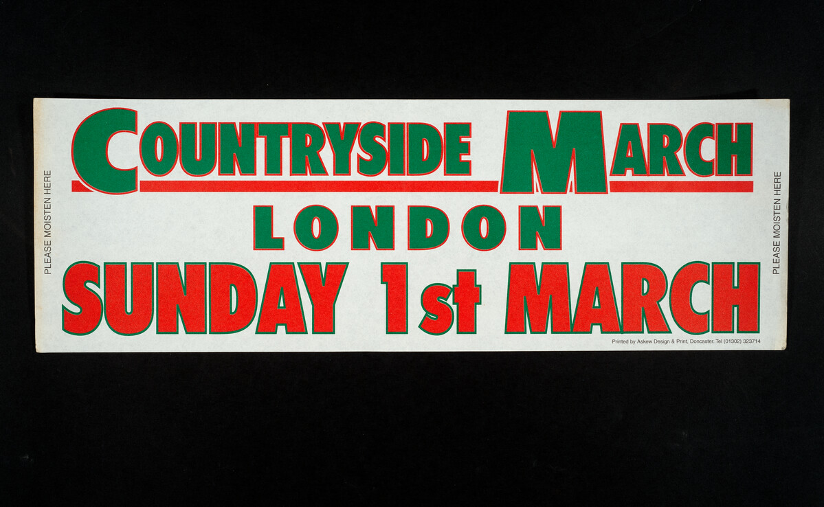 A car sticker that reads 'Countryside March London, Sunday 1st March'.