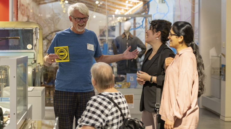 A speaker presents to visitors at The MERL.